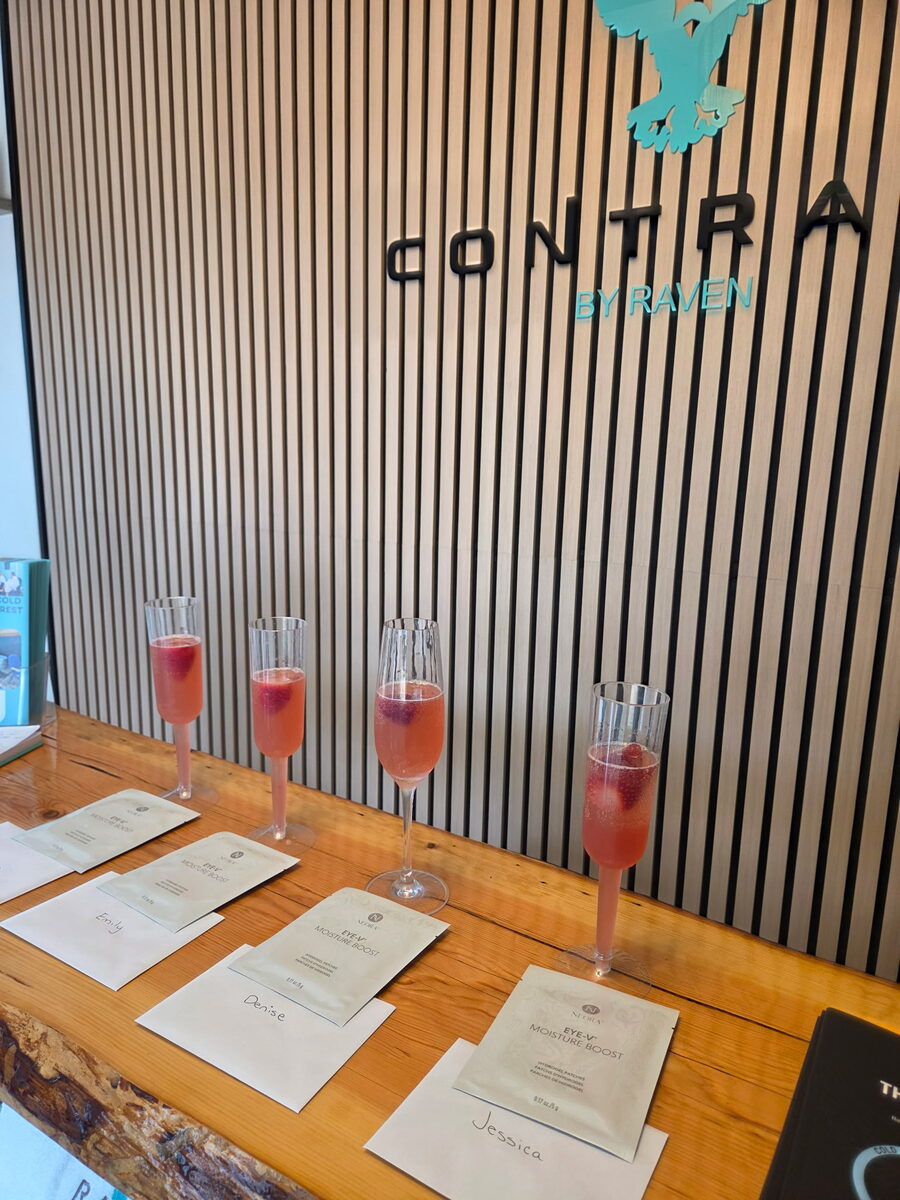 Glasses of berry mocktail set out at the Contrast by Raven reception desk for a private group