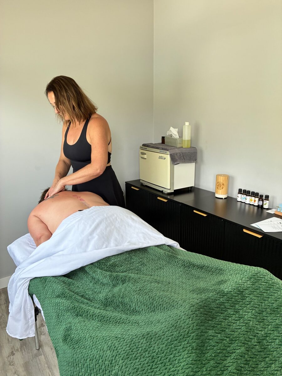 A massage treatment on a table during a private group retreat at Contrast by Raven